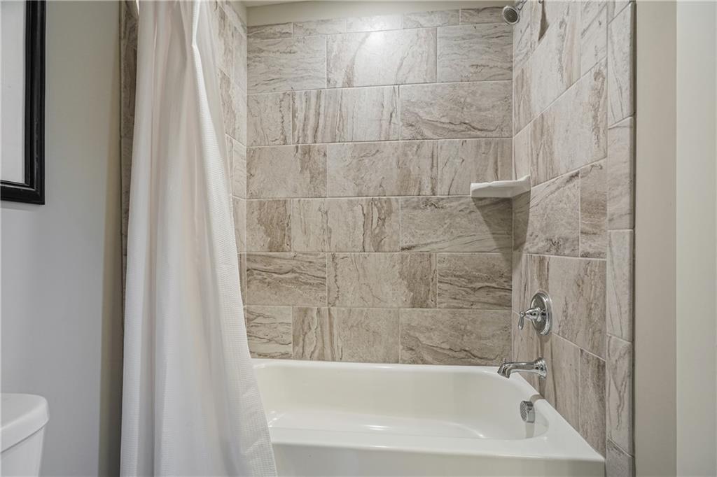 6243 Allen Ivey Road Mableton, GA 30126 - Photo 39 of 46 a bathroom with a bathtub