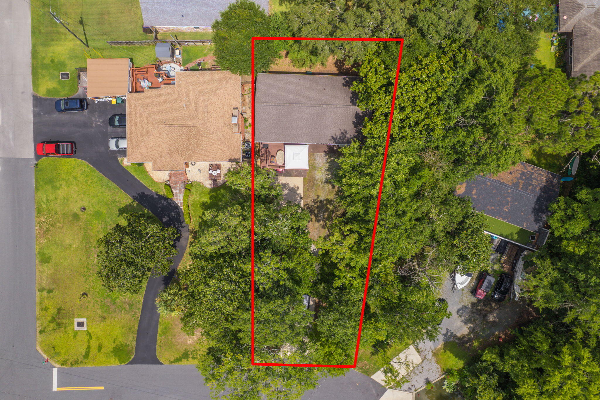 14 6th Street Shalimar, FL 32579 - Photo 2 of 64 an aerial view of a house with swimming pool and large trees