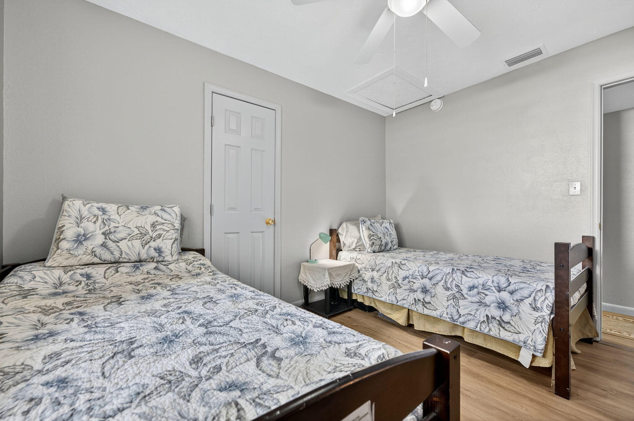 14 6th Street Shalimar, FL 32579 - Photo 22 of 64 a bedroom with two beds and a chandelier