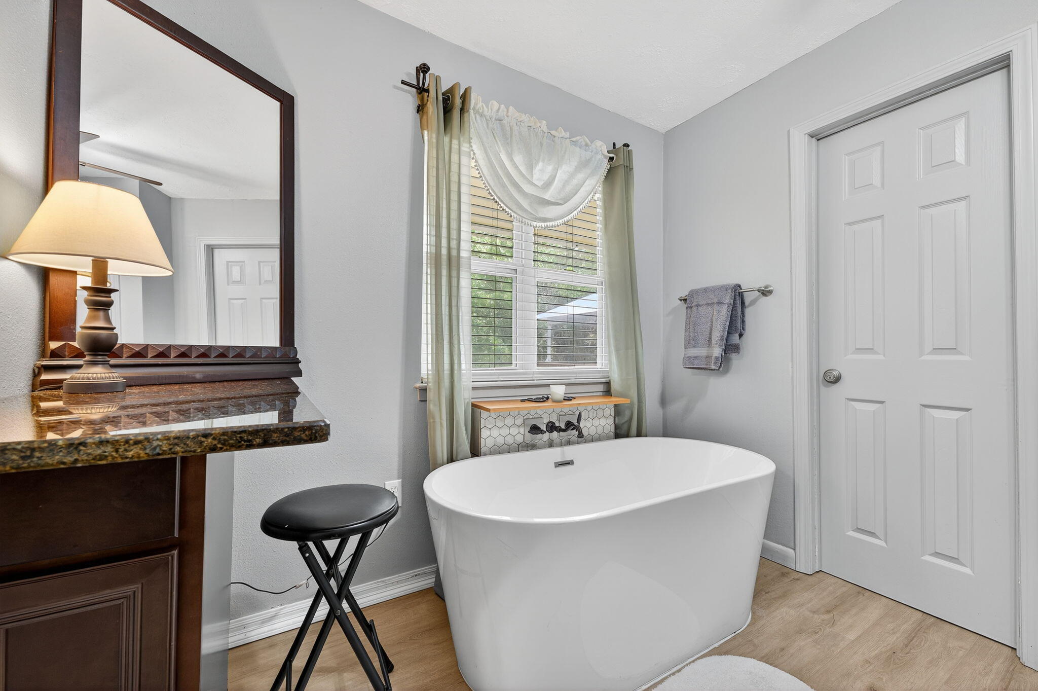 14 6th Street Shalimar, FL 32579 - Photo 27 of 64 a bathroom with a granite countertop sink and a mirror