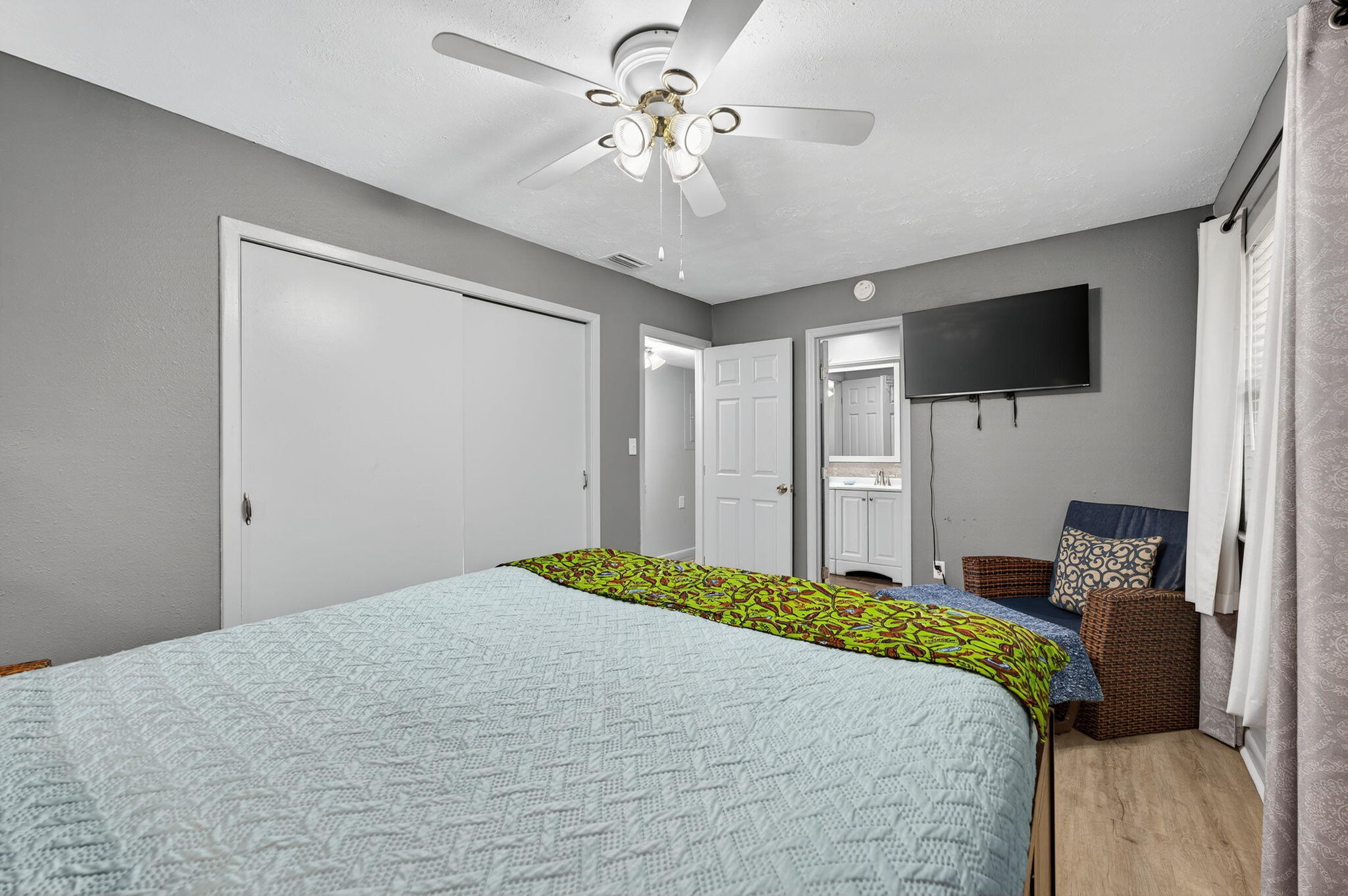 14 6th Street Shalimar, FL 32579 - Photo 35 of 64 a bedroom with a bed and a flat screen tv