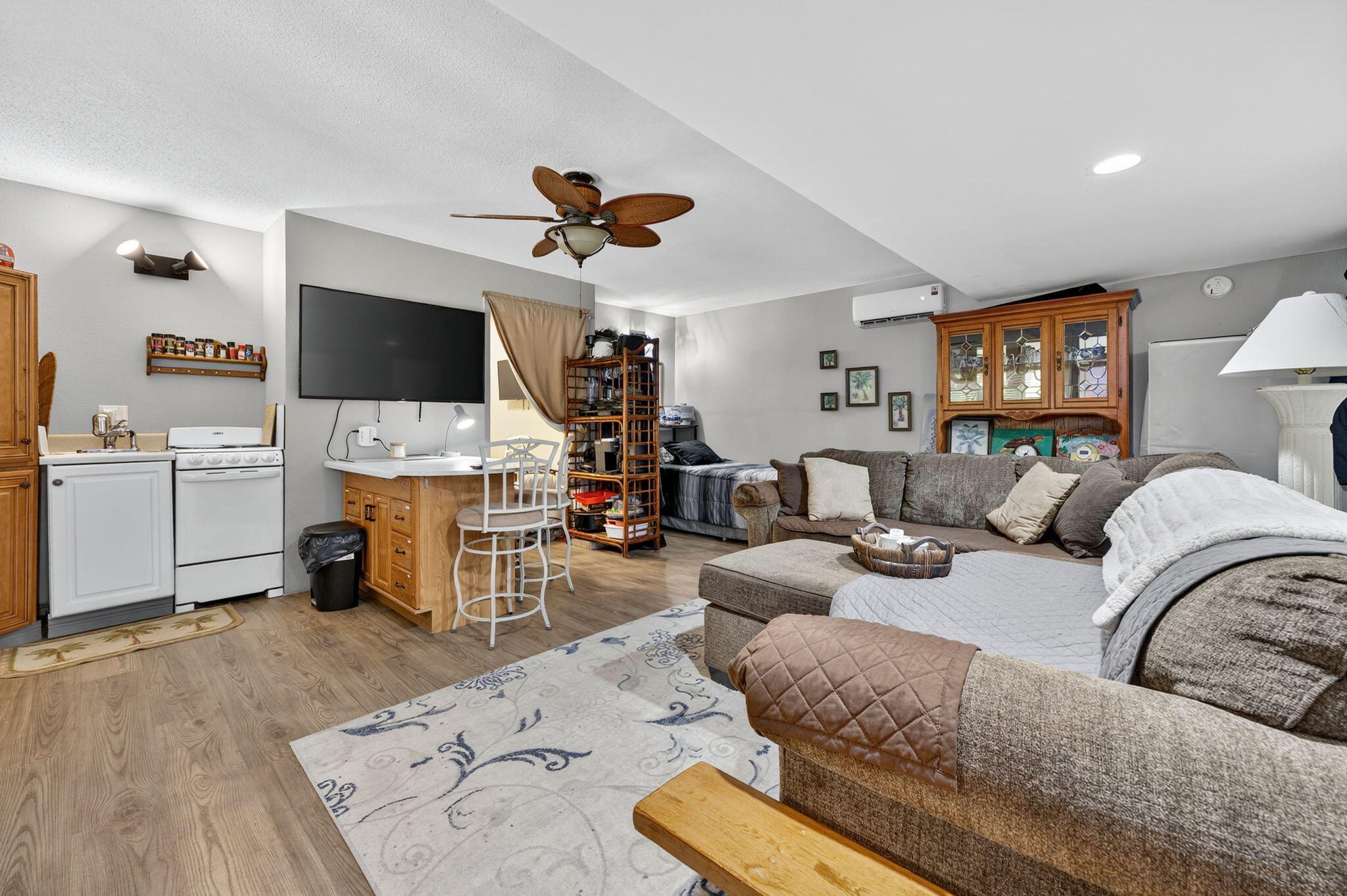 14 6th Street Shalimar, FL 32579 - Photo 39 of 64 a living room with furniture a flat screen tv and kitchen view