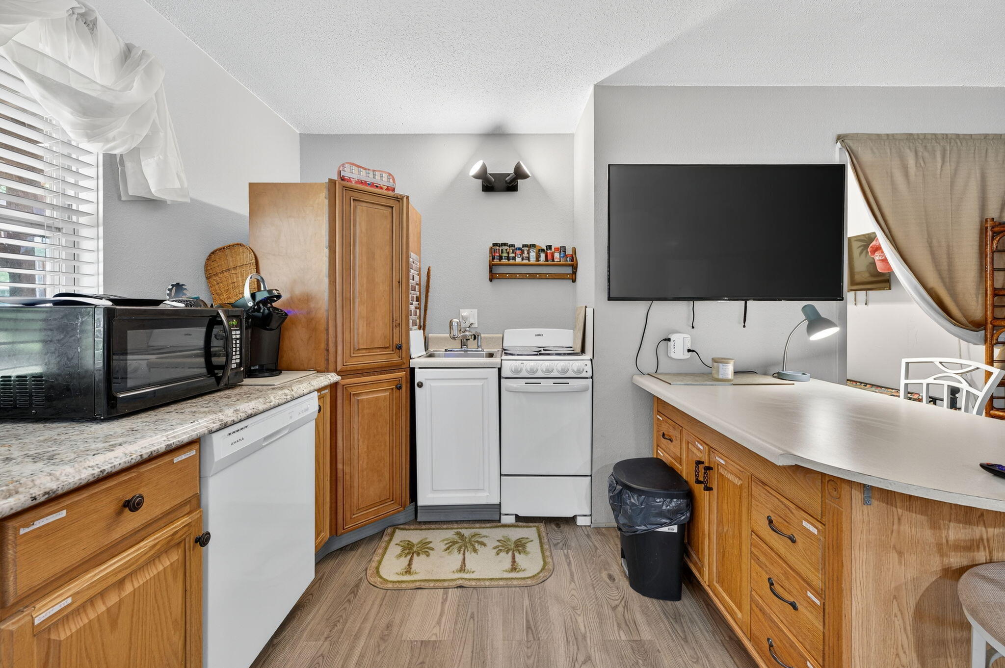 14 6th Street Shalimar, FL 32579 - Photo 45 of 64 a kitchen with a sink stove and cabinets