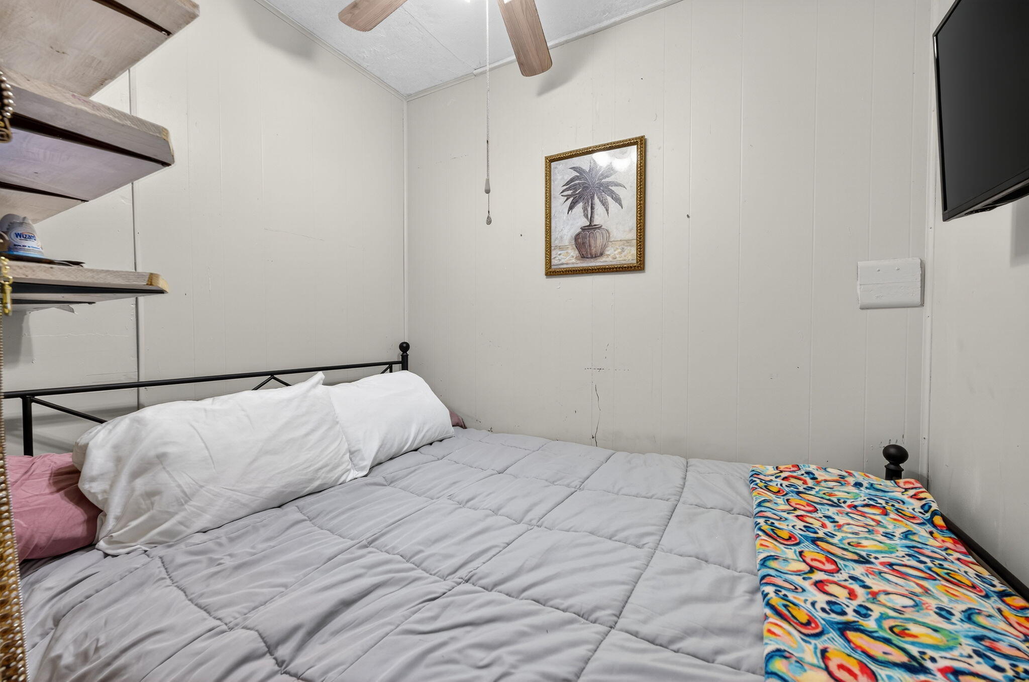 14 6th Street Shalimar, FL 32579 - Photo 48 of 64 a bedroom with a bed and a tv