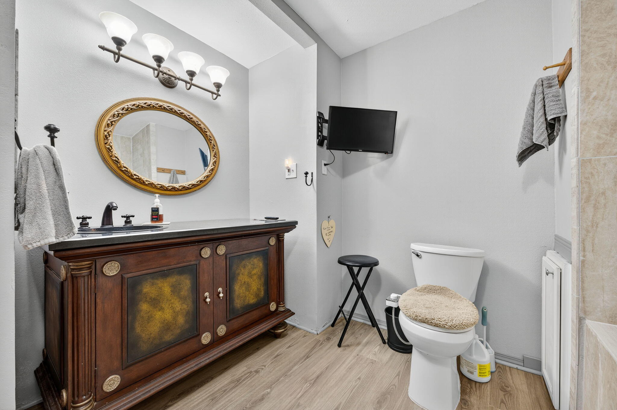 14 6th Street Shalimar, FL 32579 - Photo 54 of 64 a bathroom with a toilet a sink and a mirror