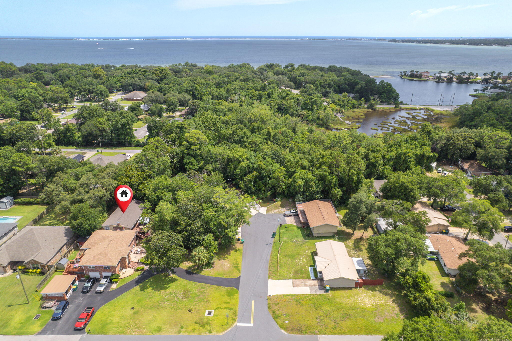 14 6th Street Shalimar, FL 32579 - Photo 6 of 64 an aerial view of a house with a yard and lake view
