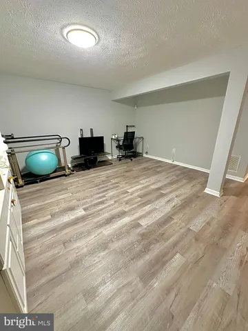 a view of a room with a car parked