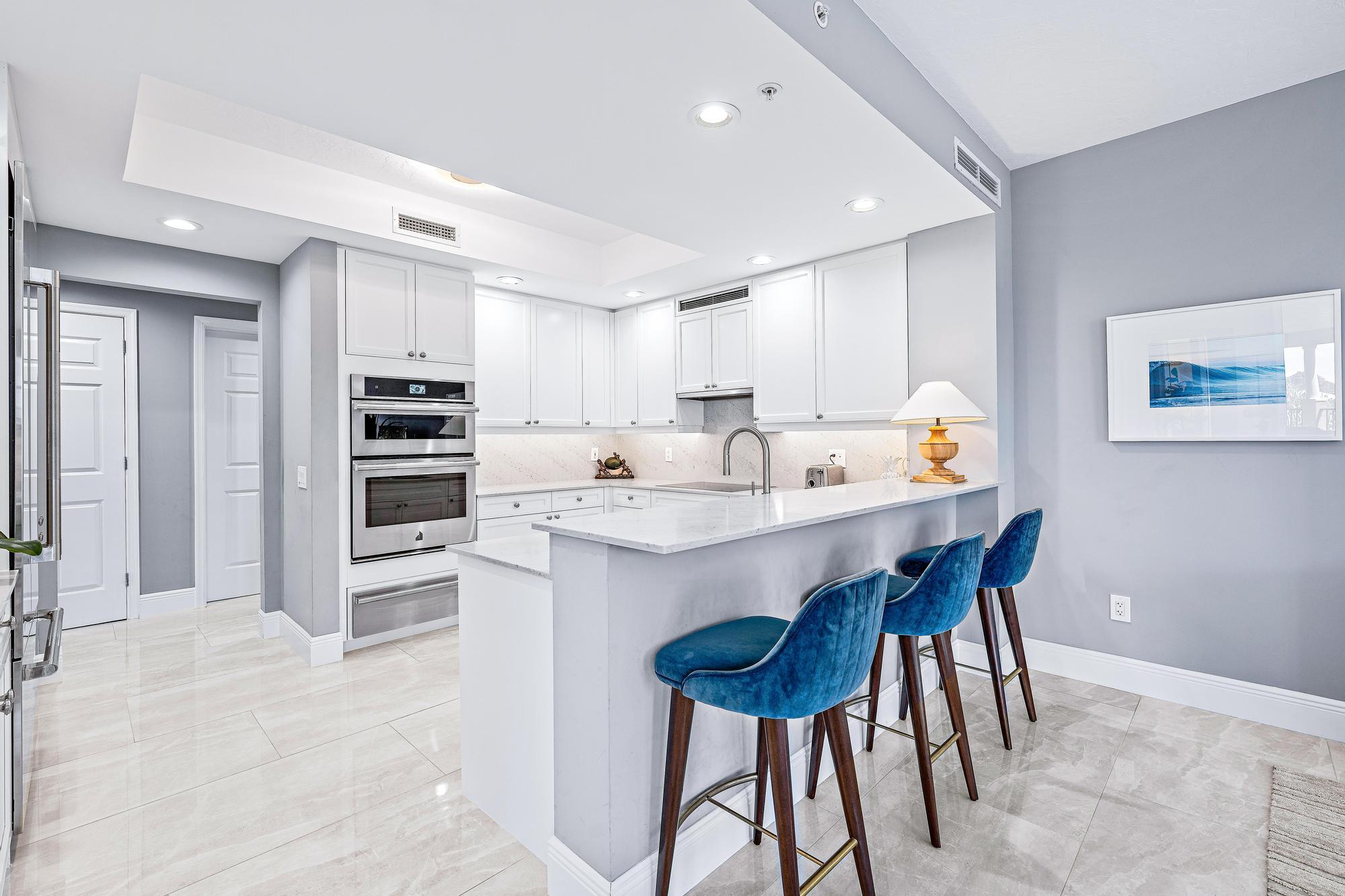 500 Highway 1, Unit 201 Jupiter, FL 33477 - Photo 13 of 38 a kitchen with stainless steel appliances a sink and a refrigerator