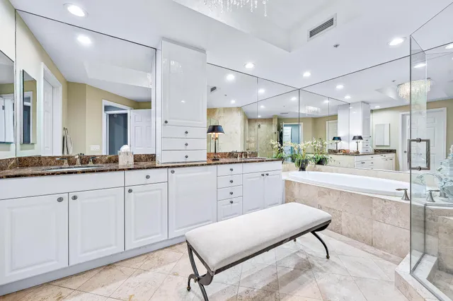 a bathroom with a bathtub and a shower