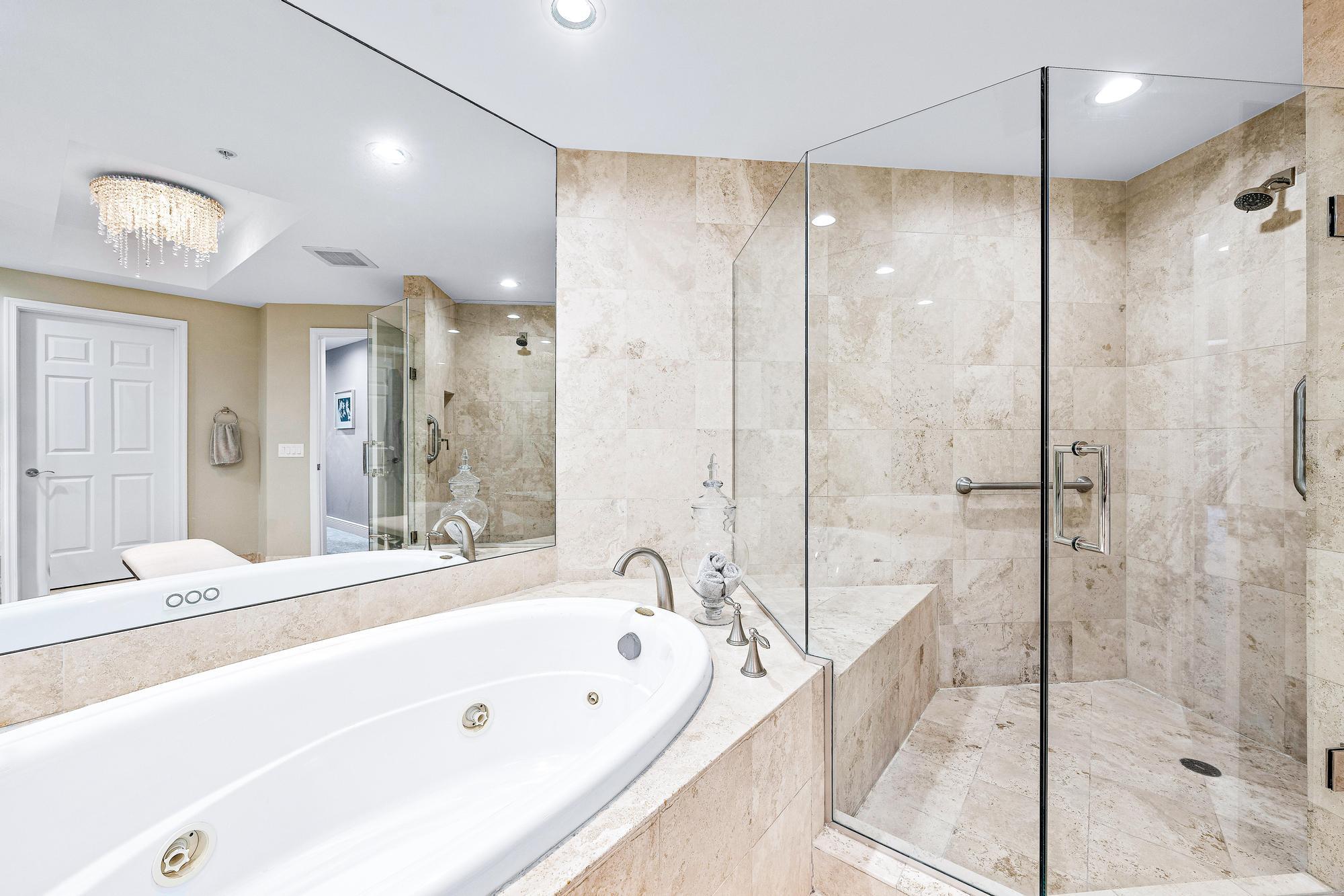 500 Highway 1, Unit 201 Jupiter, FL 33477 - Photo 22 of 38 a bathroom with a bathtub and a shower