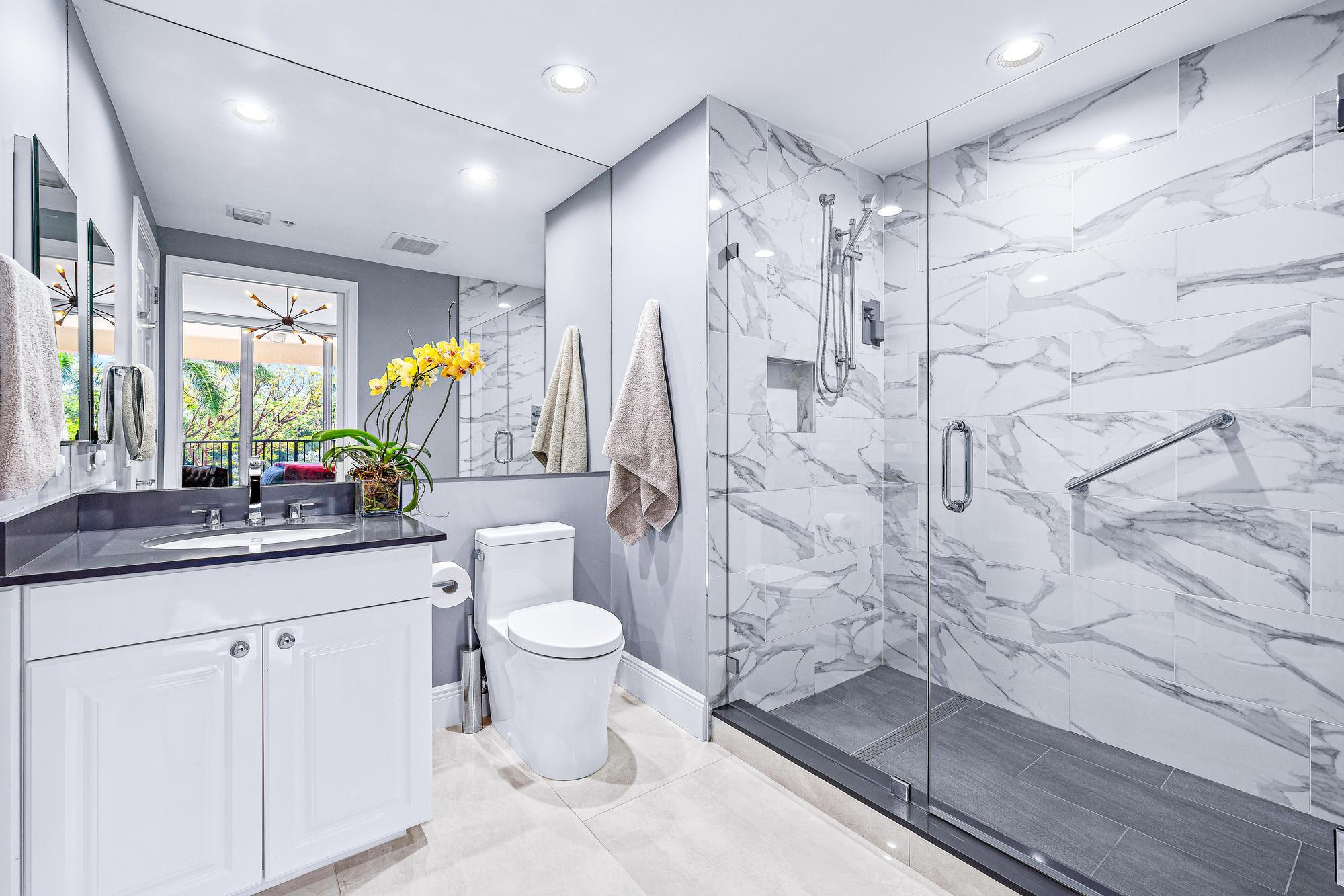 500 Highway 1, Unit 201 Jupiter, FL 33477 - Photo 24 of 38 a bathroom with a sink toilet and shower