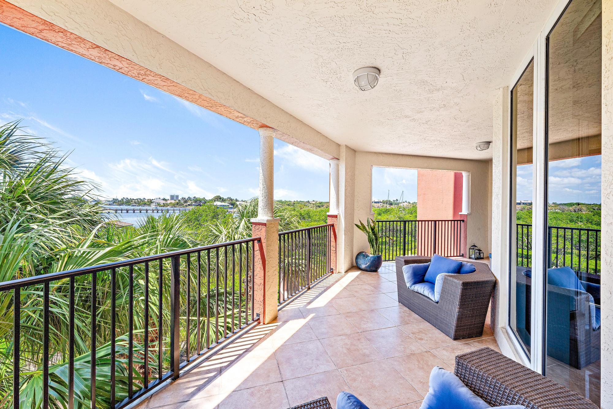 500 Highway 1, Unit 201 Jupiter, FL 33477 - Photo 31 of 38 a balcony with furniture and a potted plant