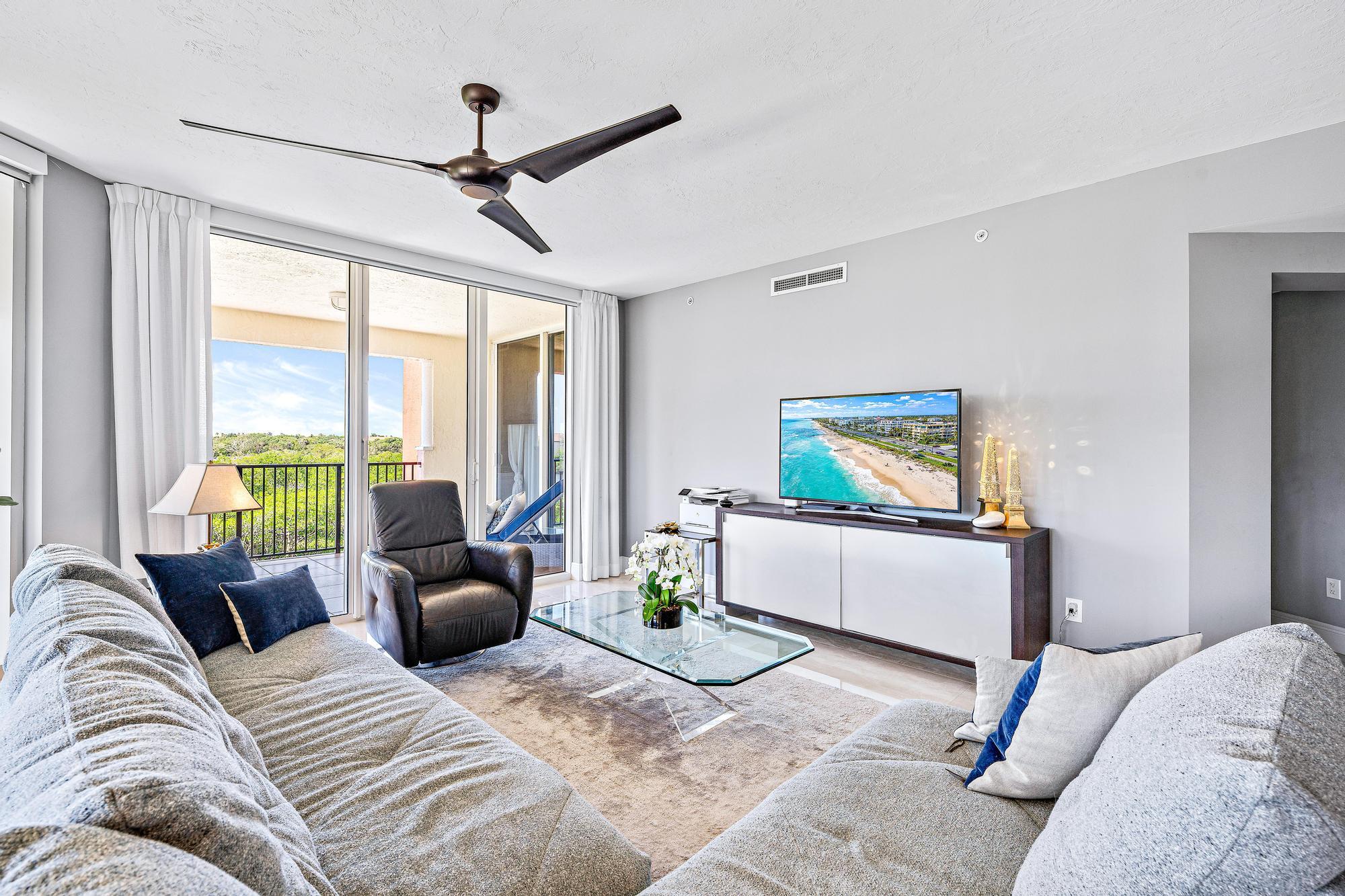 500 Highway 1, Unit 201 Jupiter, FL 33477 - Photo 7 of 38 a living room with furniture and a flat screen tv