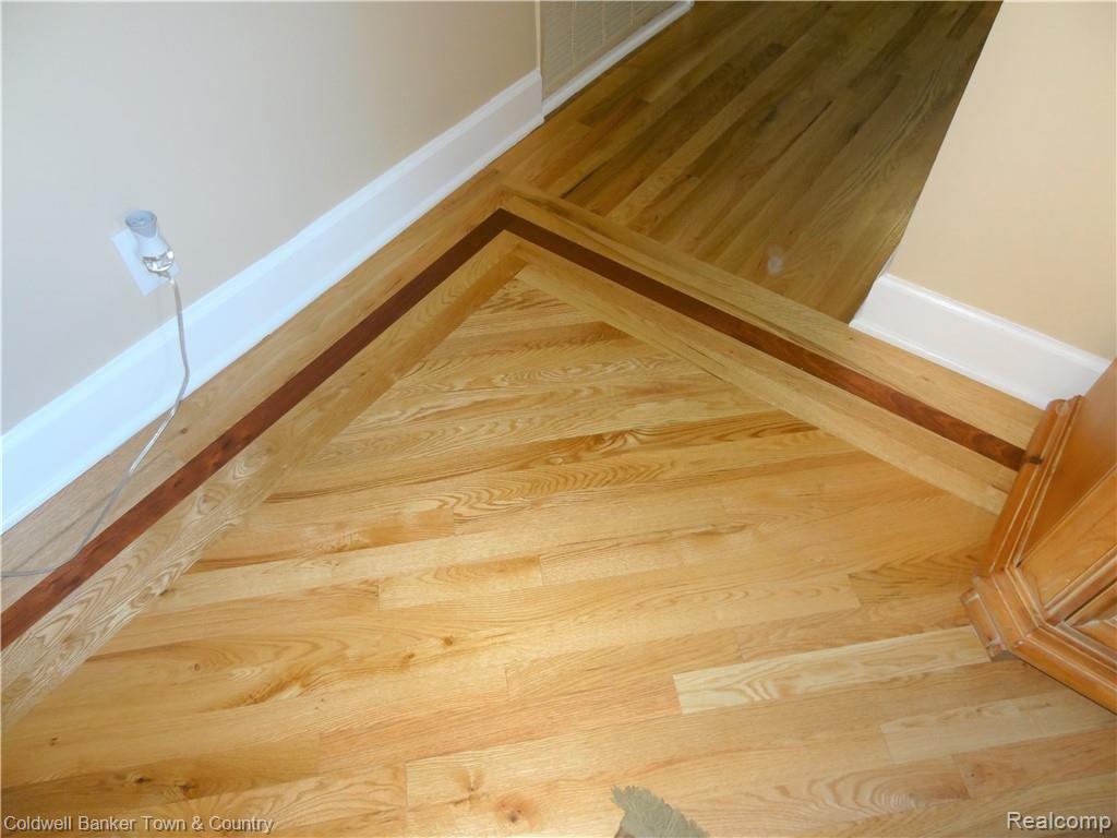 223 Ruppert Street Commerce Township, MI 48382 - Photo 10 of 31 Notice the detail to the hardwood floors. Very sharp!