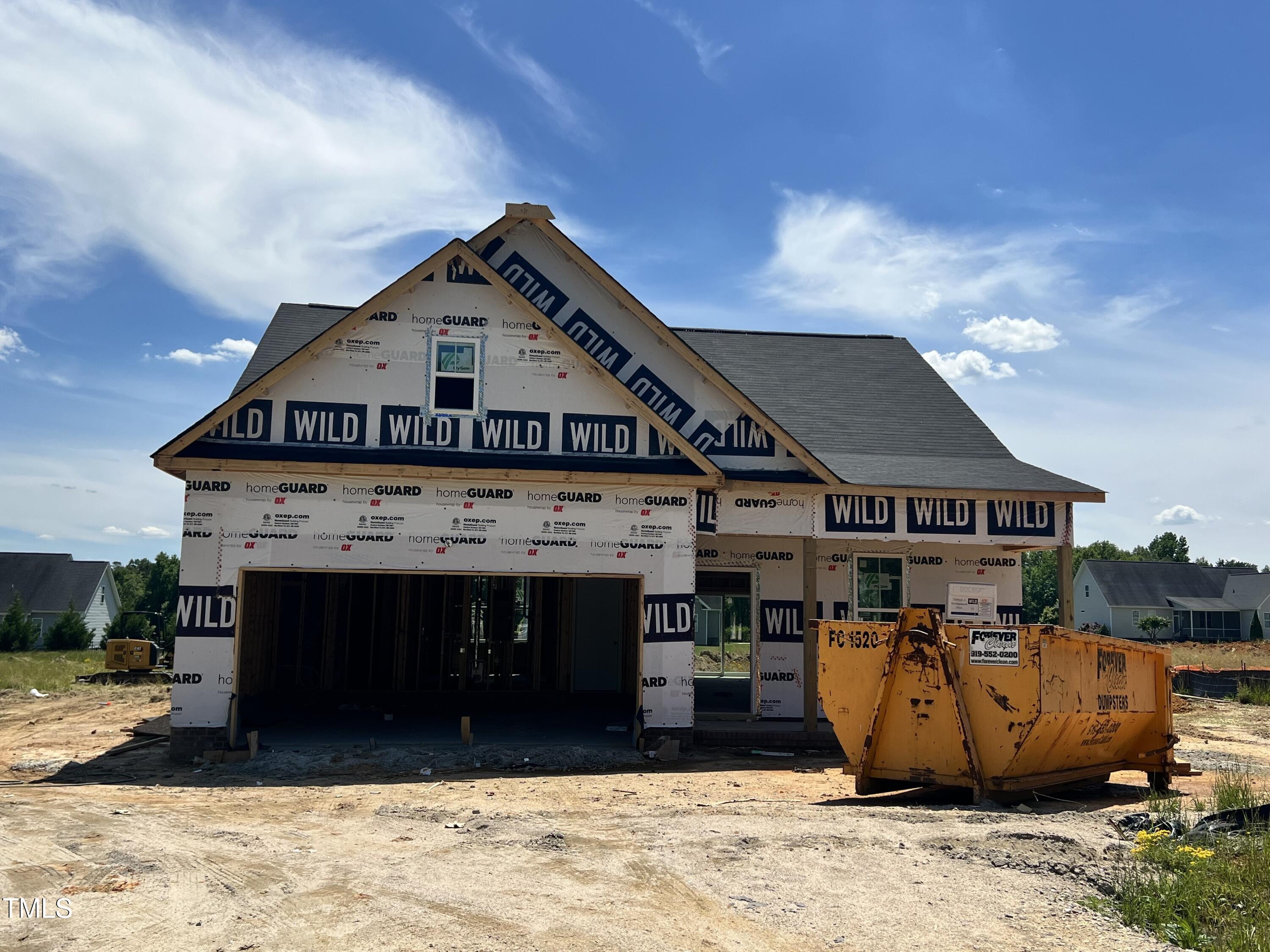 450 Springtooth Drive Zebulon, NC 27597 - Photo 2 of 9 a view of a big house with wooden fence