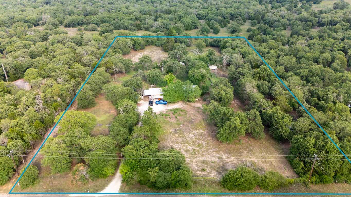 664 Hidden Oaks Drive Elgin, TX 78621 - Photo 20 of 35 an aerial view of a houses with yard