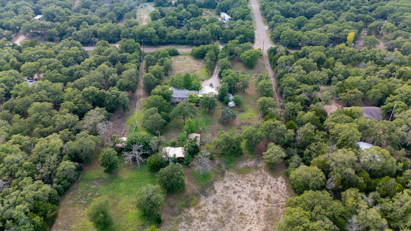 664 Hidden Oaks Drive Elgin, TX 78621 - Photo 21 of 35 an aerial view of a houses with a yard