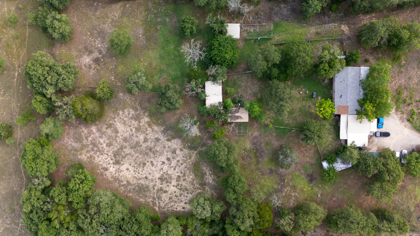 664 Hidden Oaks Drive Elgin, TX 78621 - Photo 22 of 35 an aerial view of a house with a yard