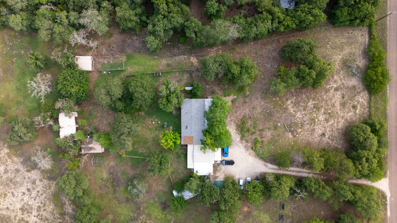 664 Hidden Oaks Drive Elgin, TX 78621 - Photo 23 of 35 an aerial view of a house with a yard
