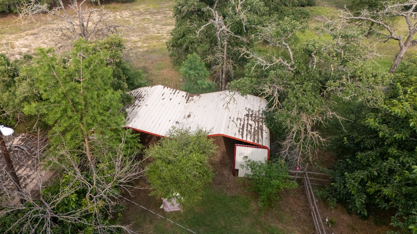 664 Hidden Oaks Drive Elgin, TX 78621 - Photo 24 of 35 an aerial view of a house with yard and outdoor seating