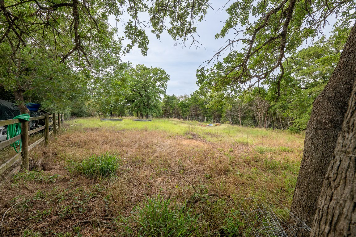 664 Hidden Oaks Drive Elgin, TX 78621 - Photo 25 of 35 a view of a field with trees in the background