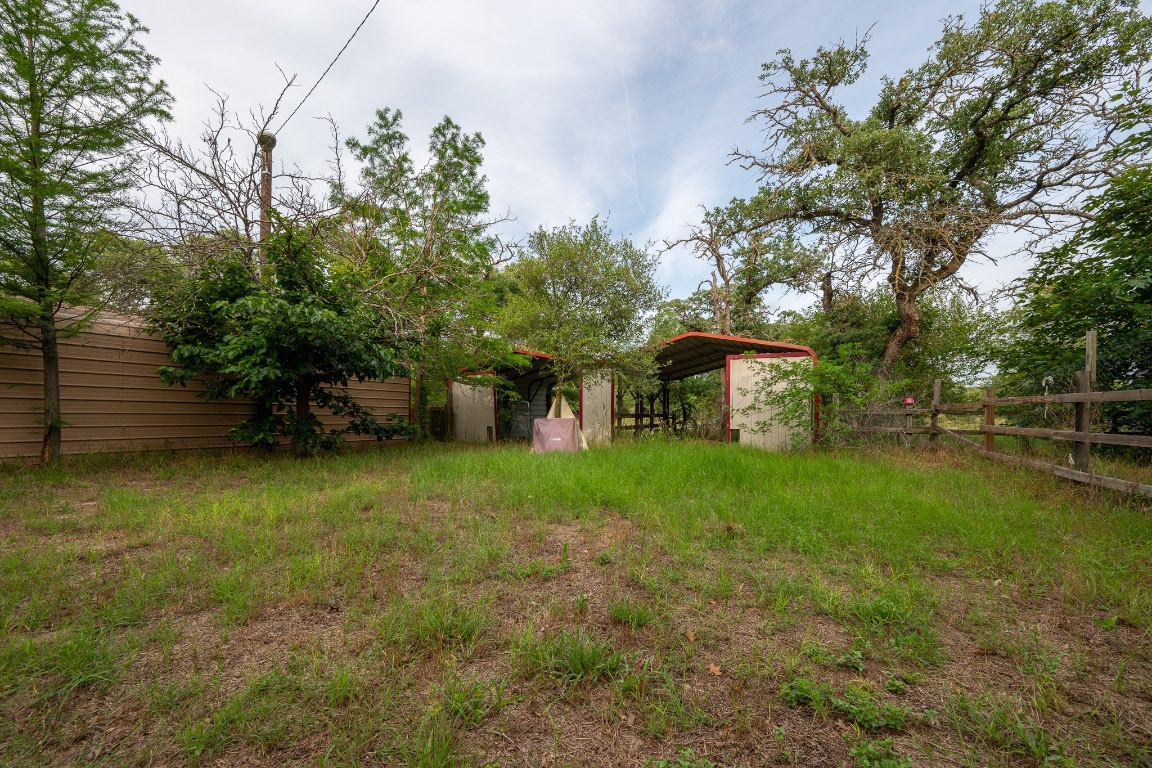 664 Hidden Oaks Drive Elgin, TX 78621 - Photo 29 of 35 a front view of a house with garden