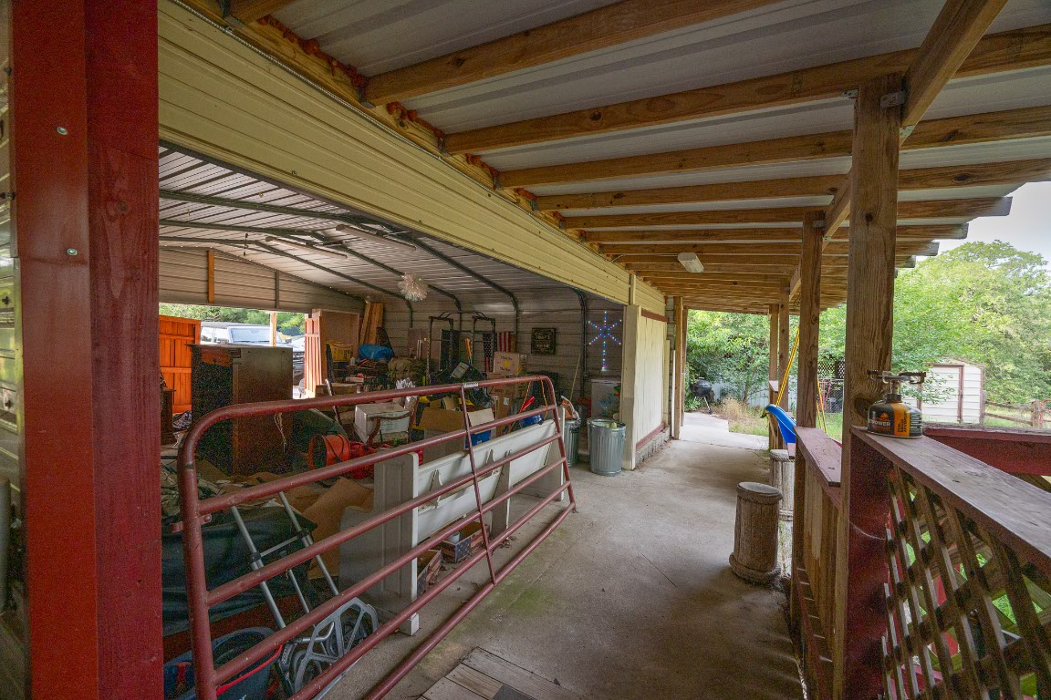664 Hidden Oaks Drive Elgin, TX 78621 - Photo 7 of 35 a view of a room with gym equipment