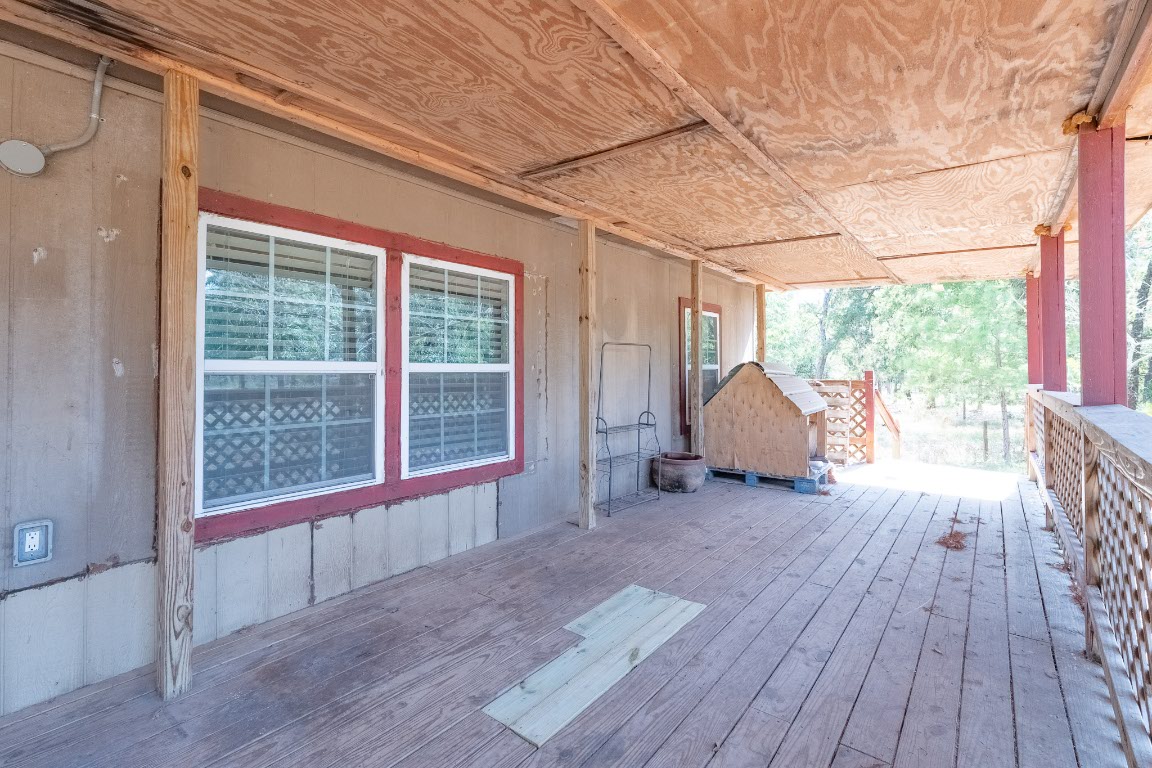 664 Hidden Oaks Drive Elgin, TX 78621 - Photo 10 of 35 a view of a room with wooden floor and a window