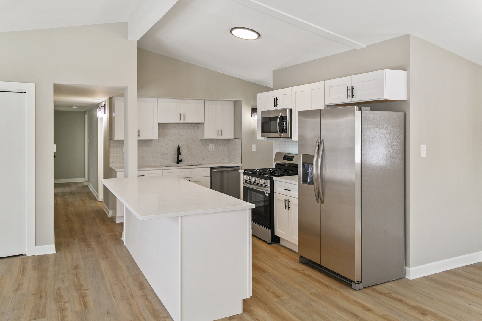 6305 Robert Road Cary, IL 60013 - Photo 5 of 23 a kitchen with stainless steel appliances a refrigerator sink and cabinets