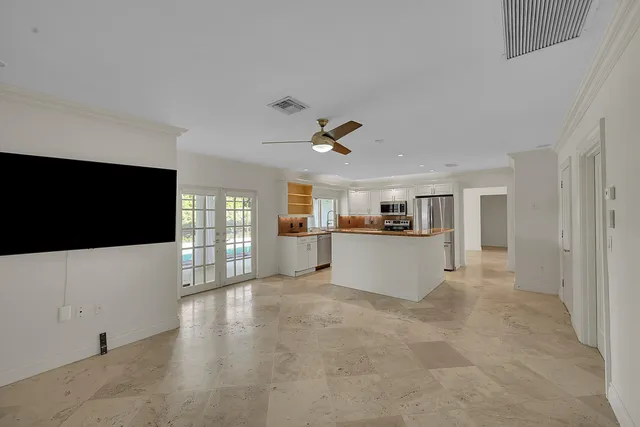 a bathroom with a granite countertop sink a mirror and a shower