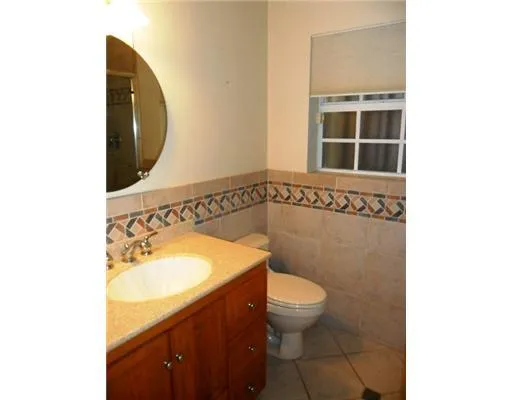 a utility room with sink dryer and washer