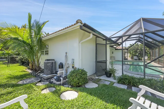 a aerial view of a house with a yard and plants