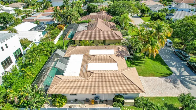 an aerial view of a house with outdoor space and street view
