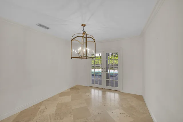 a kitchen with stainless steel appliances granite countertop a refrigerator a sink a stove and a refrigerator with wooden floor