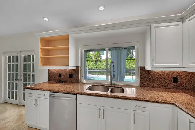 a kitchen with a refrigerator sink and microwave