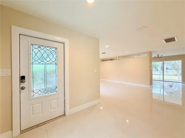 a view of an empty room with a window