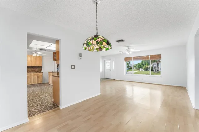 a view of an entryway with wooden floor
