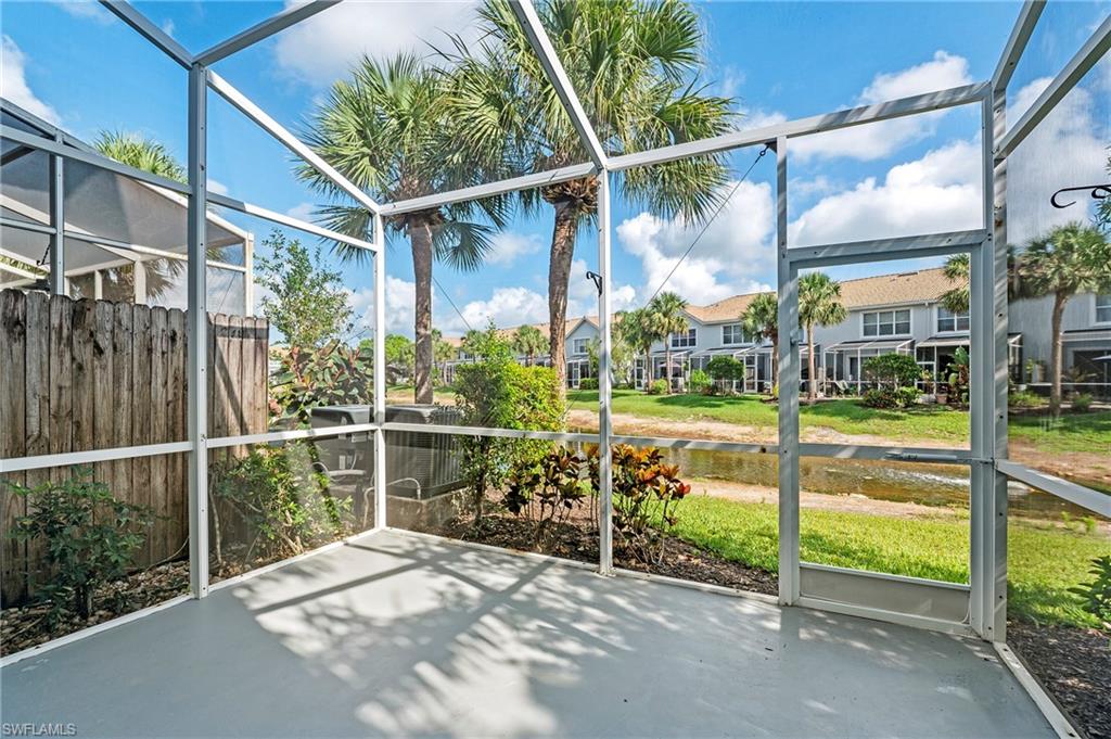 15570 Marcello Circle, Unit 149 Naples, FL 34110 - Photo 12 of 31 a view of a door with a floor to ceiling window