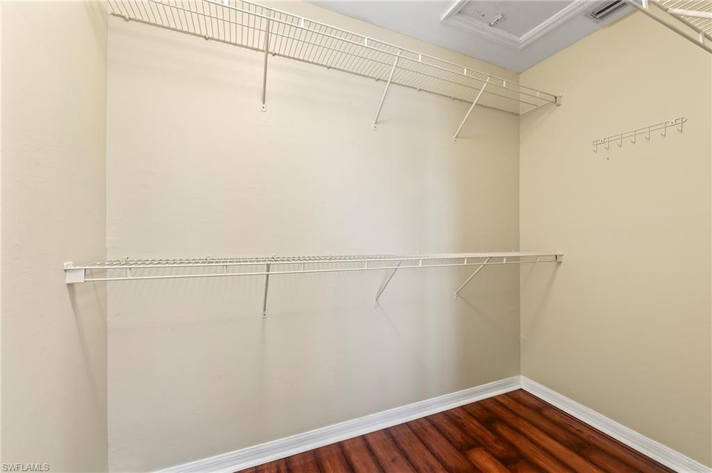 15570 Marcello Circle, Unit 149 Naples, FL 34110 - Photo 20 of 31 a view of a room with racks on the wall