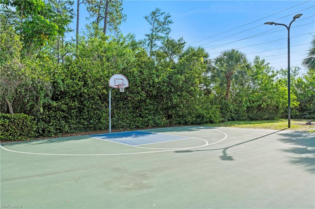 15570 Marcello Circle, Unit 149 Naples, FL 34110 - Photo 30 of 31 a view of a tennis court