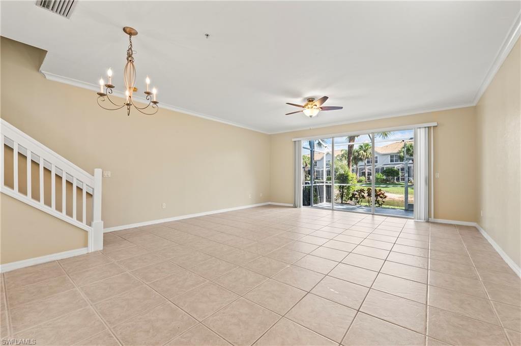 15570 Marcello Circle, Unit 149 Naples, FL 34110 - Photo 3 of 31 a view of an empty room with a window