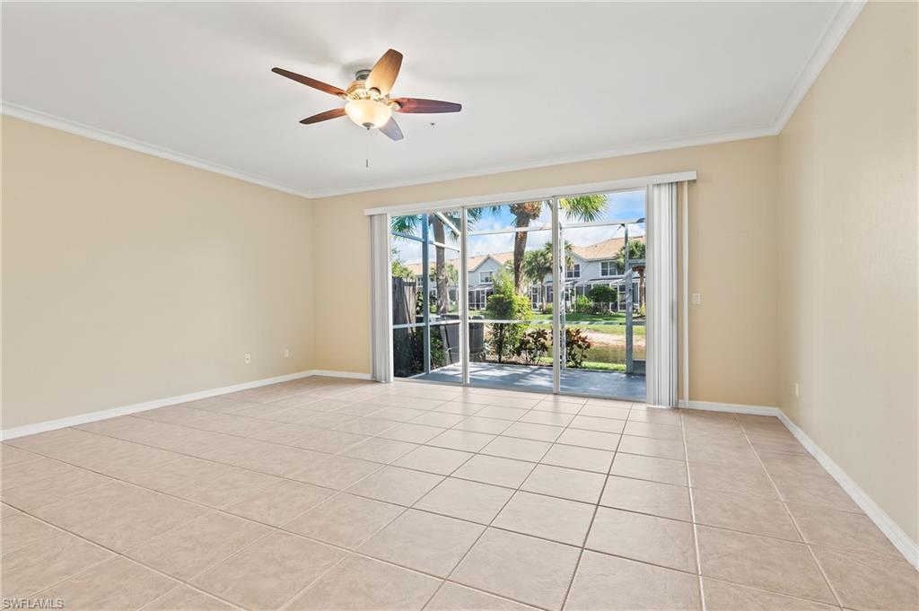 15570 Marcello Circle, Unit 149 Naples, FL 34110 - Photo 4 of 31 a view of an empty room with a window