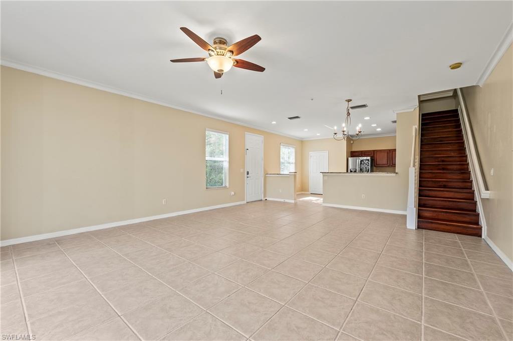 15570 Marcello Circle, Unit 149 Naples, FL 34110 - Photo 6 of 31 a view of an empty room with a window