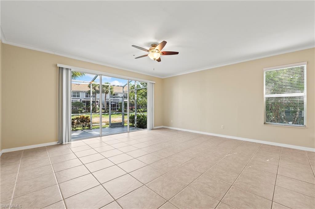 15570 Marcello Circle, Unit 149 Naples, FL 34110 - Photo 7 of 31 a view of an empty room with a window