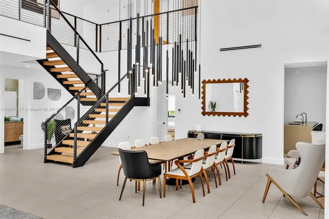 a dining room with furniture and entryway