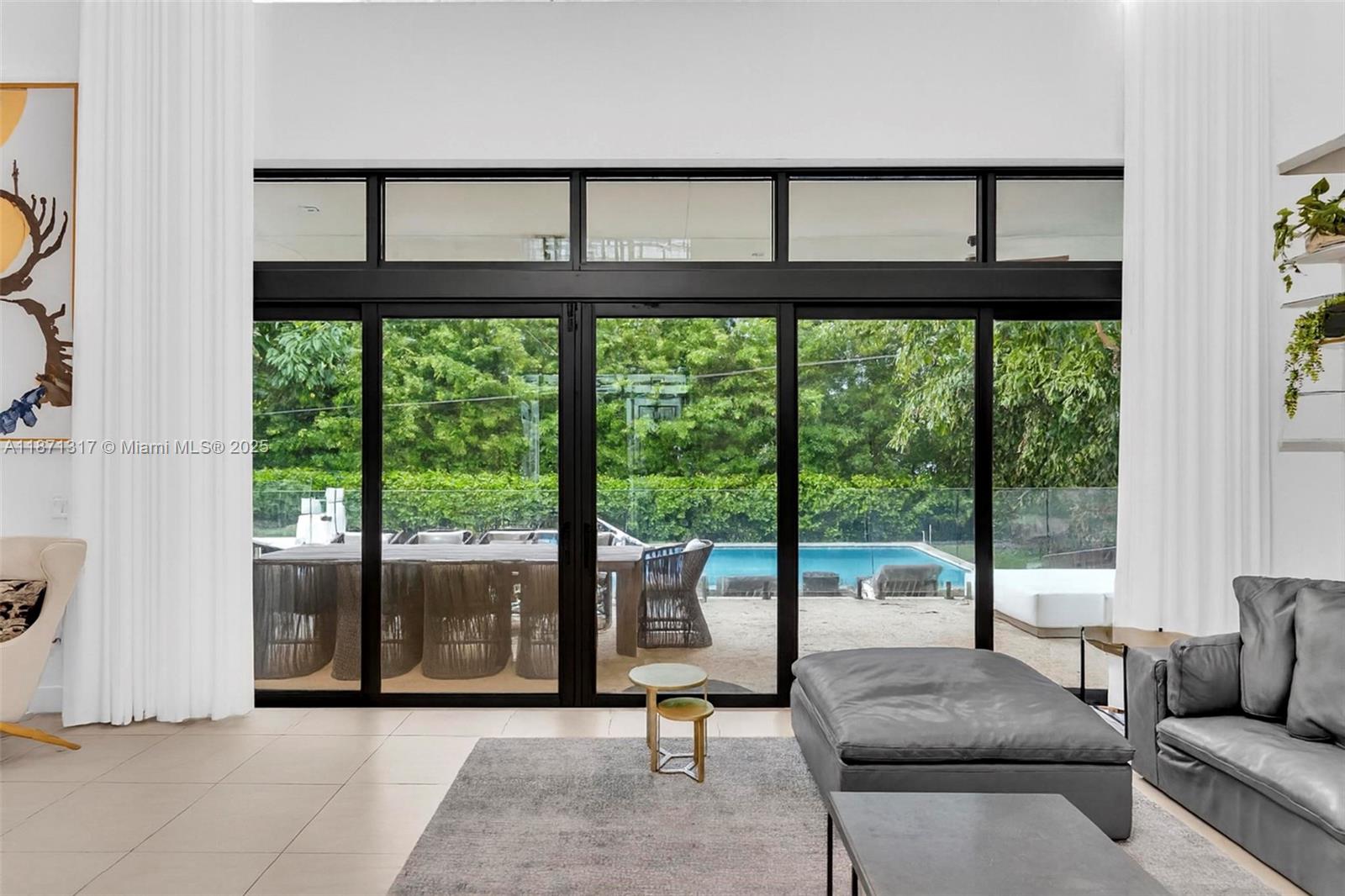 1350 98th Street Bay Harbor Islands, FL 33154 - Photo 14 of 46 a living room with furniture and a large window