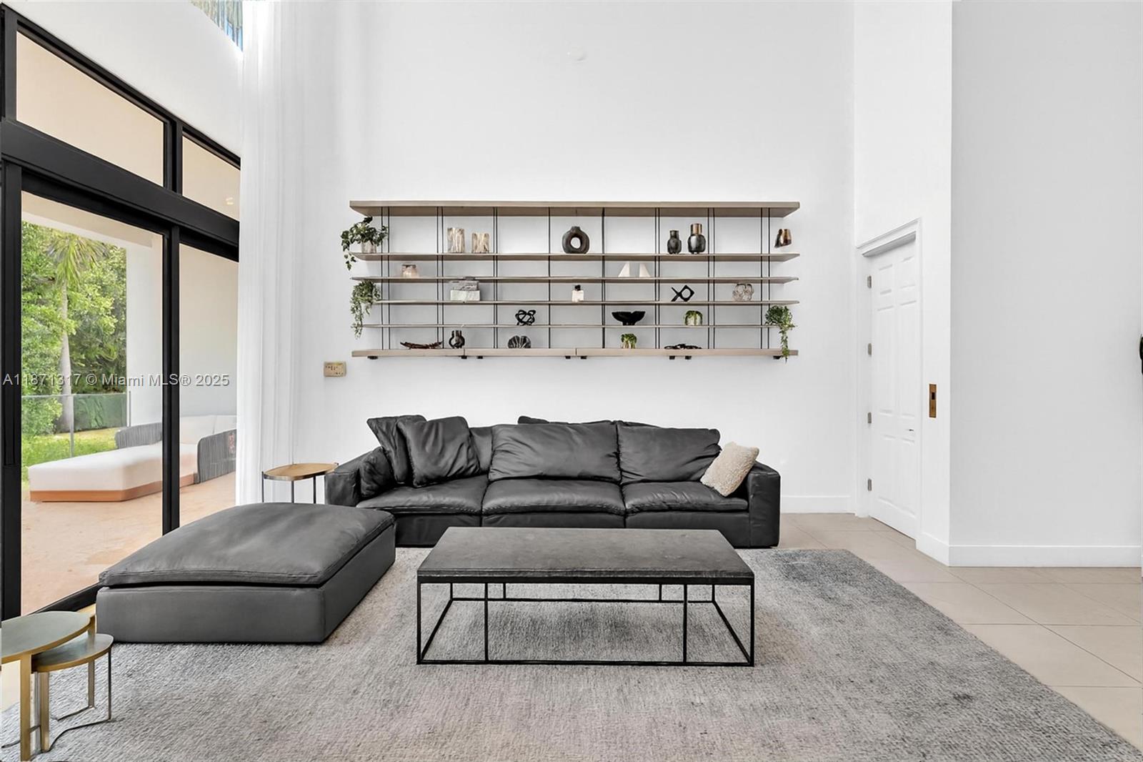 1350 98th Street Bay Harbor Islands, FL 33154 - Photo 15 of 46 a living room with furniture and a floor to ceiling window