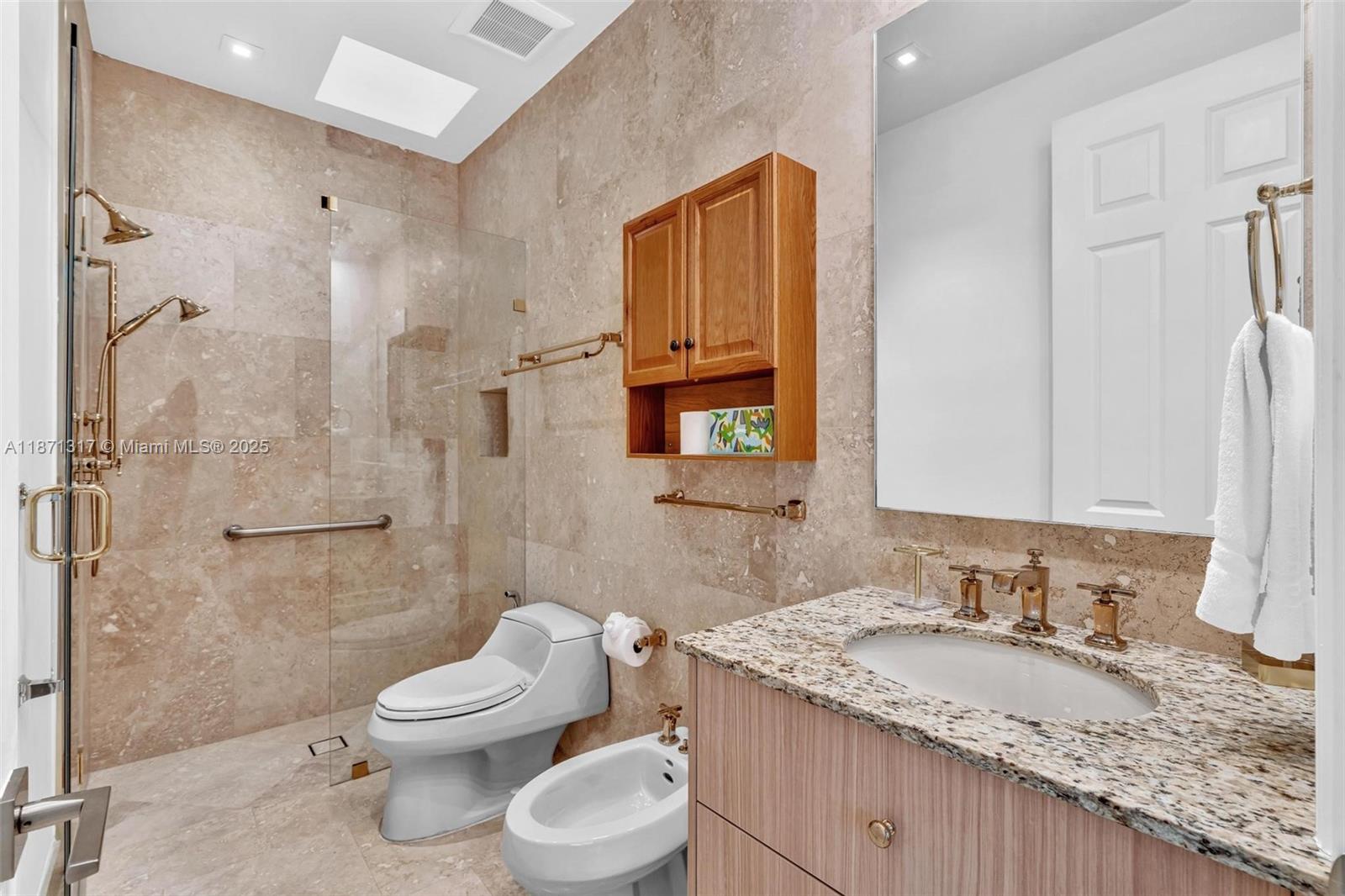 1350 98th Street Bay Harbor Islands, FL 33154 - Photo 26 of 46 a bathroom with a granite countertop sink toilet and shower