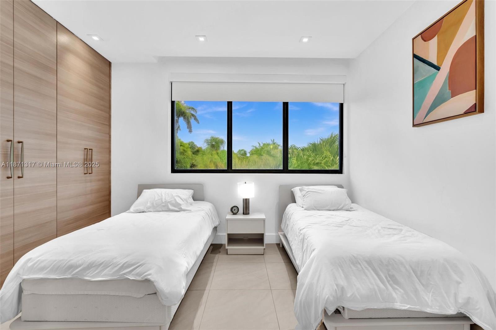 1350 98th Street Bay Harbor Islands, FL 33154 - Photo 28 of 46 a bedroom with two beds and a wall painting