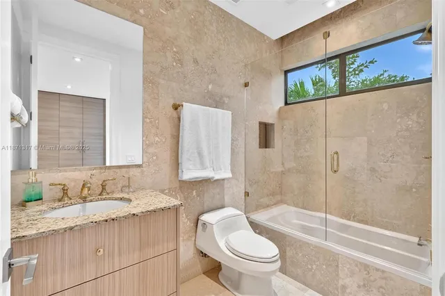 a spacious bedroom with a bed and a shower